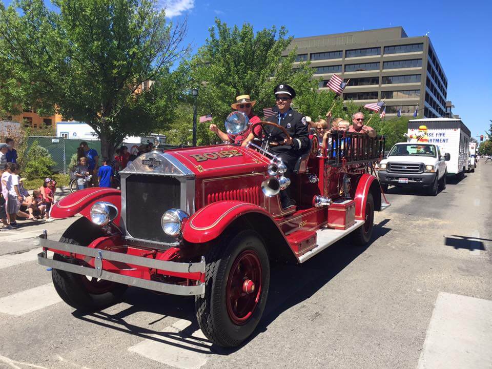 Vintage Boise fire truck driving in the 4th of July Independence Day Parade